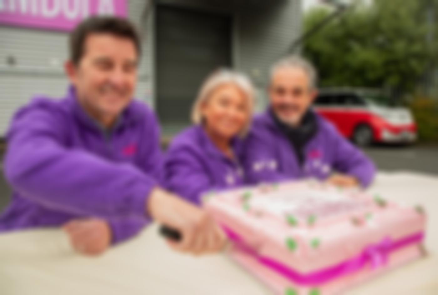 The Directors of Carambola cutting the 21st birthday cake