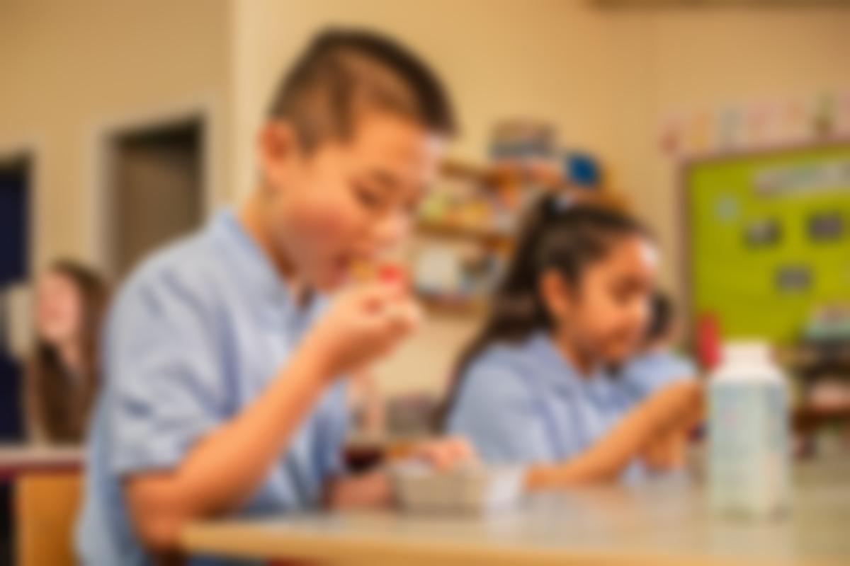 Children eating Carambola lunches